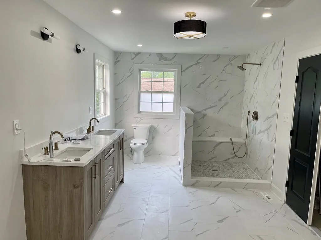 Completed bathroom remodel with walk-in shower by Delpa Builders