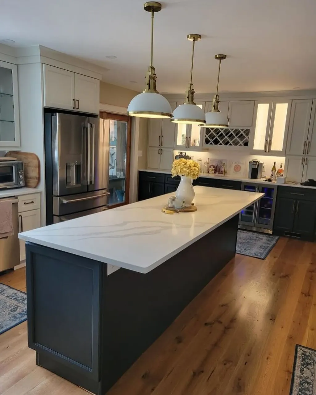 Slate island and long stone worktop in a kitchen remodeled by Delpa Builders